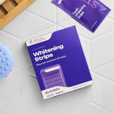Teeth whitening strip application demonstration